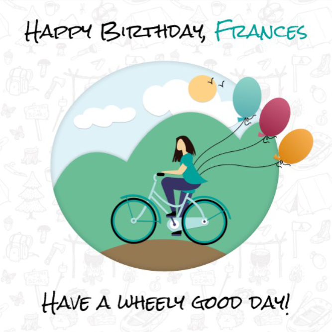 Photo of an lady riding a bike on a sunny day with birthday balloons attached to the bike.